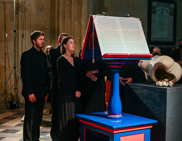 choir singing in a darkened church