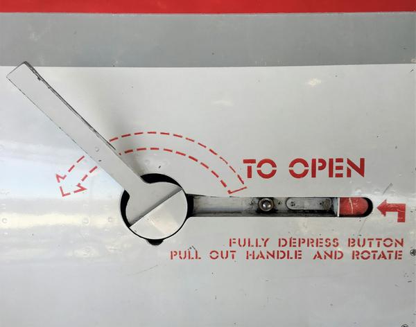 close-up of a hatch door with printed instructions on how to use it