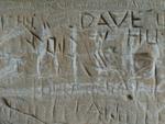 a rock with writing on it that says, the cave